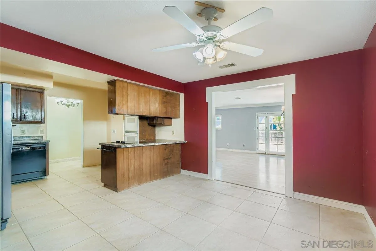 3245 Valley Street Carlsbad, CA 92008 - Photo 11 of 30 a view of a kitchen with a sink and a refrigerator