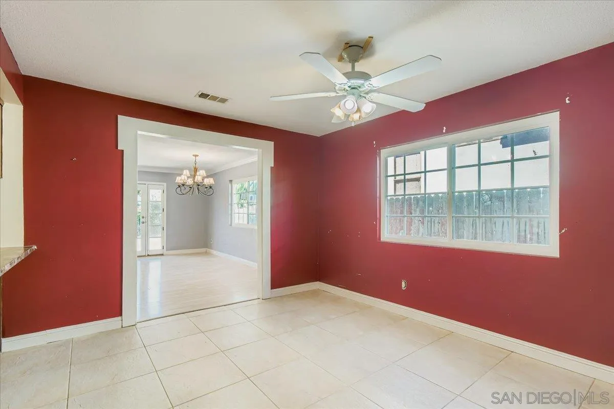 3245 Valley Street Carlsbad, CA 92008 - Photo 12 of 30 an empty room with windows and fan
