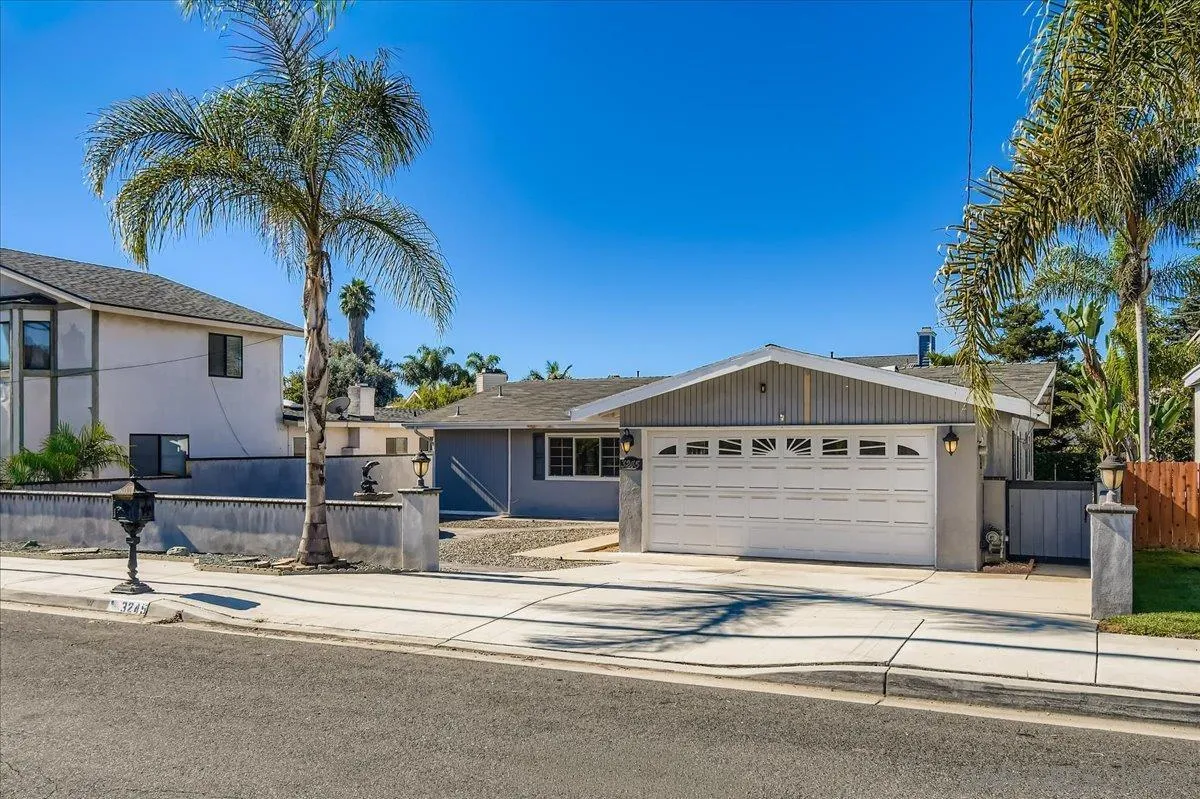 3245 Valley Street Carlsbad, CA 92008 - Photo 2 of 30 a front view of a house with a yard
