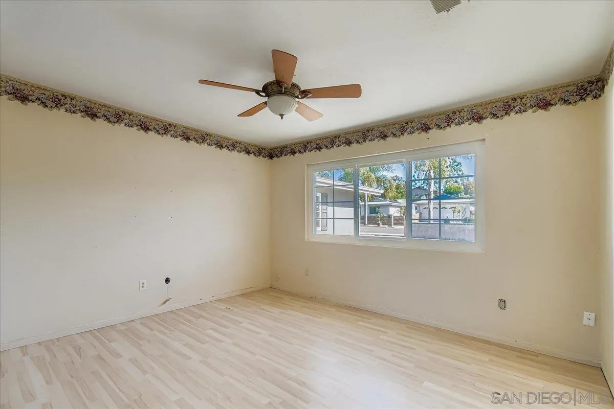 3245 Valley Street Carlsbad, CA 92008 - Photo 22 of 30 a view of a big room with wooden floor closet and windows
