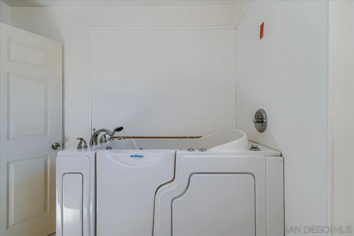 3245 Valley Street Carlsbad, CA 92008 - Photo 25 of 30 a bathroom with a sink and mirror
