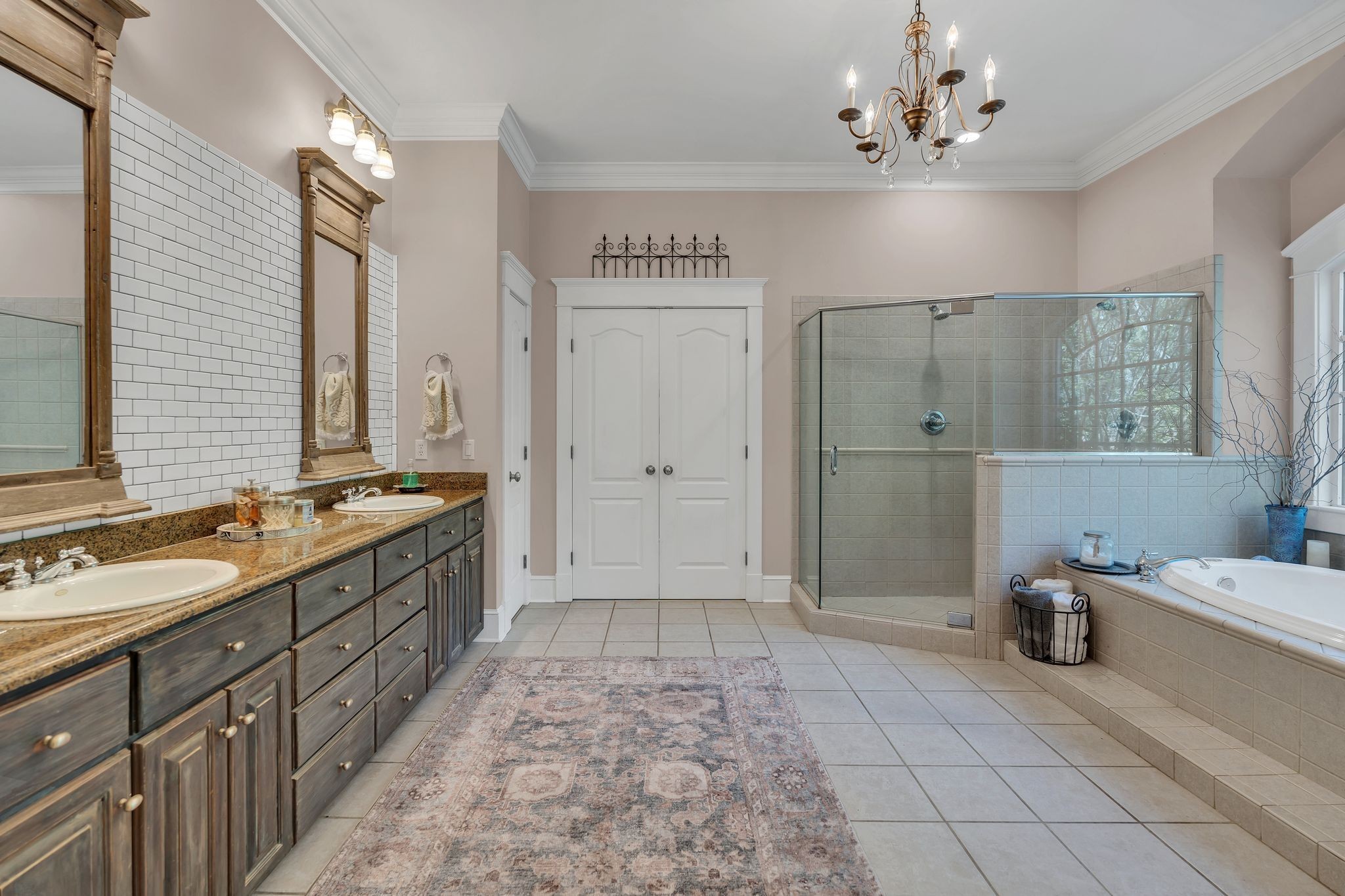 94 Oak Shadow Drive Loretto, TN 38469 - Photo 18 of 68 a spacious bathroom with a double vanity sink a mirror and a shower