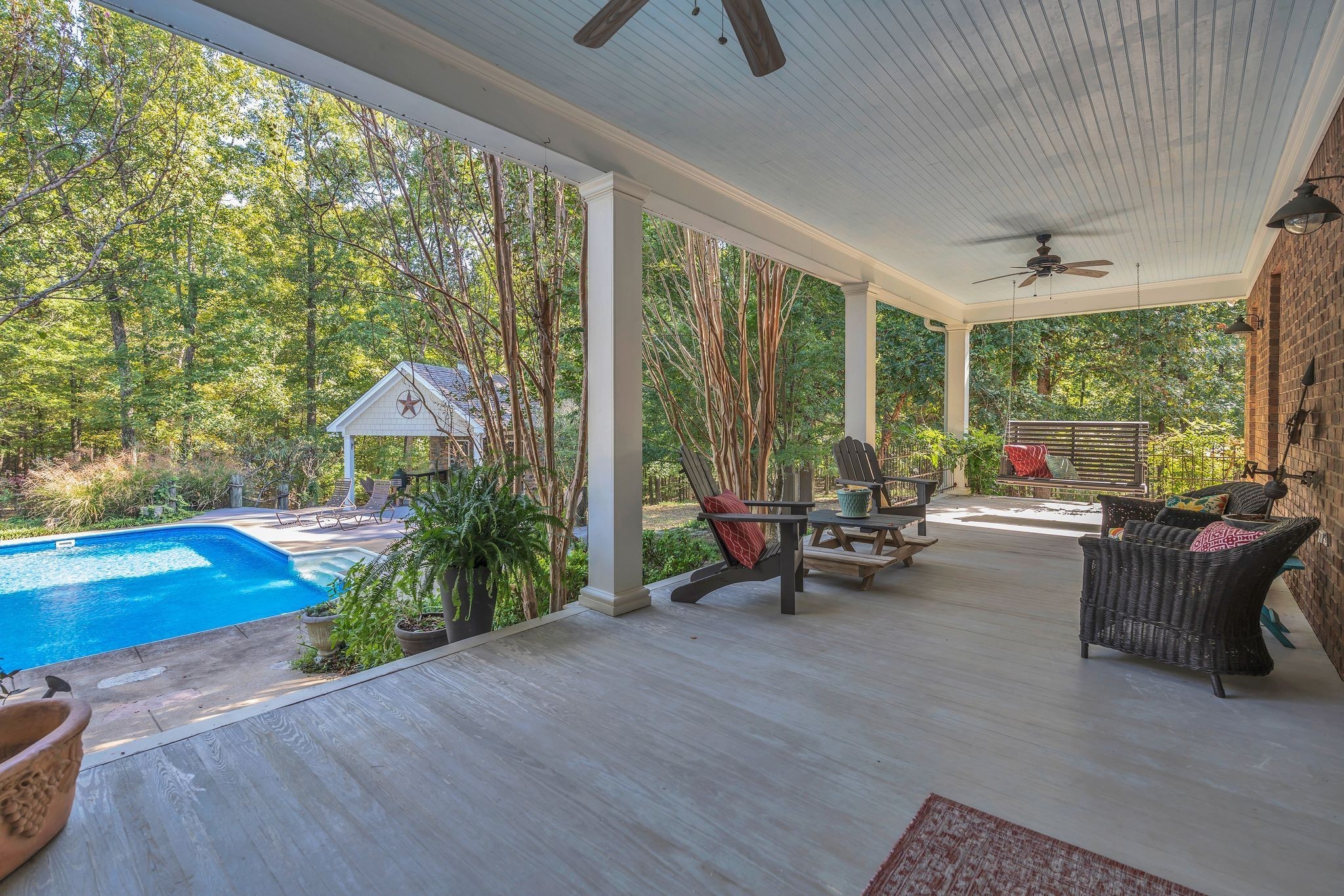 94 Oak Shadow Drive Loretto, TN 38469 - Photo 25 of 68 a living room with patio furniture and a floor to ceiling window