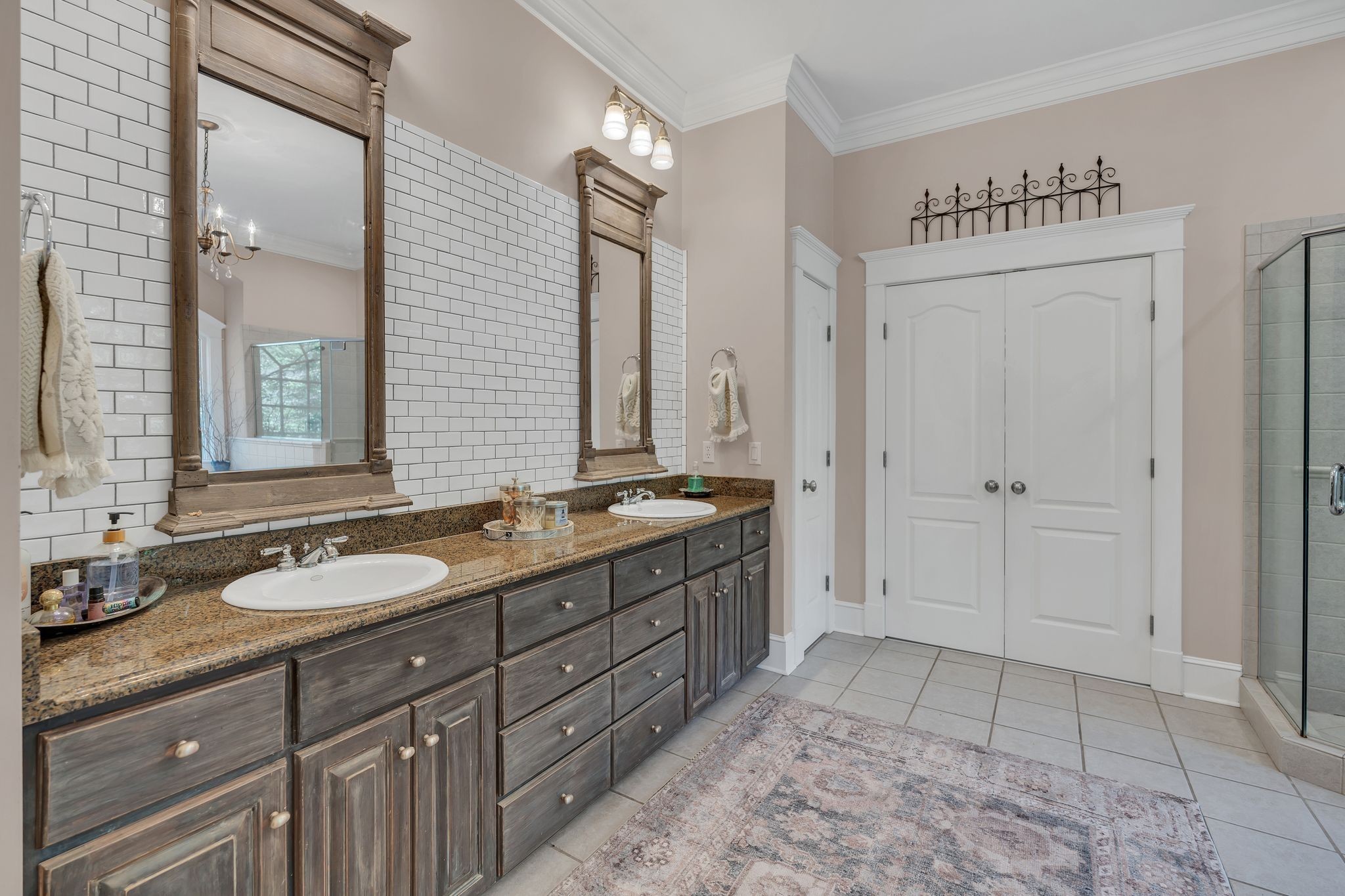 94 Oak Shadow Drive Loretto, TN 38469 - Photo 35 of 68 a spacious bathroom with a granite countertop sink a mirror and a