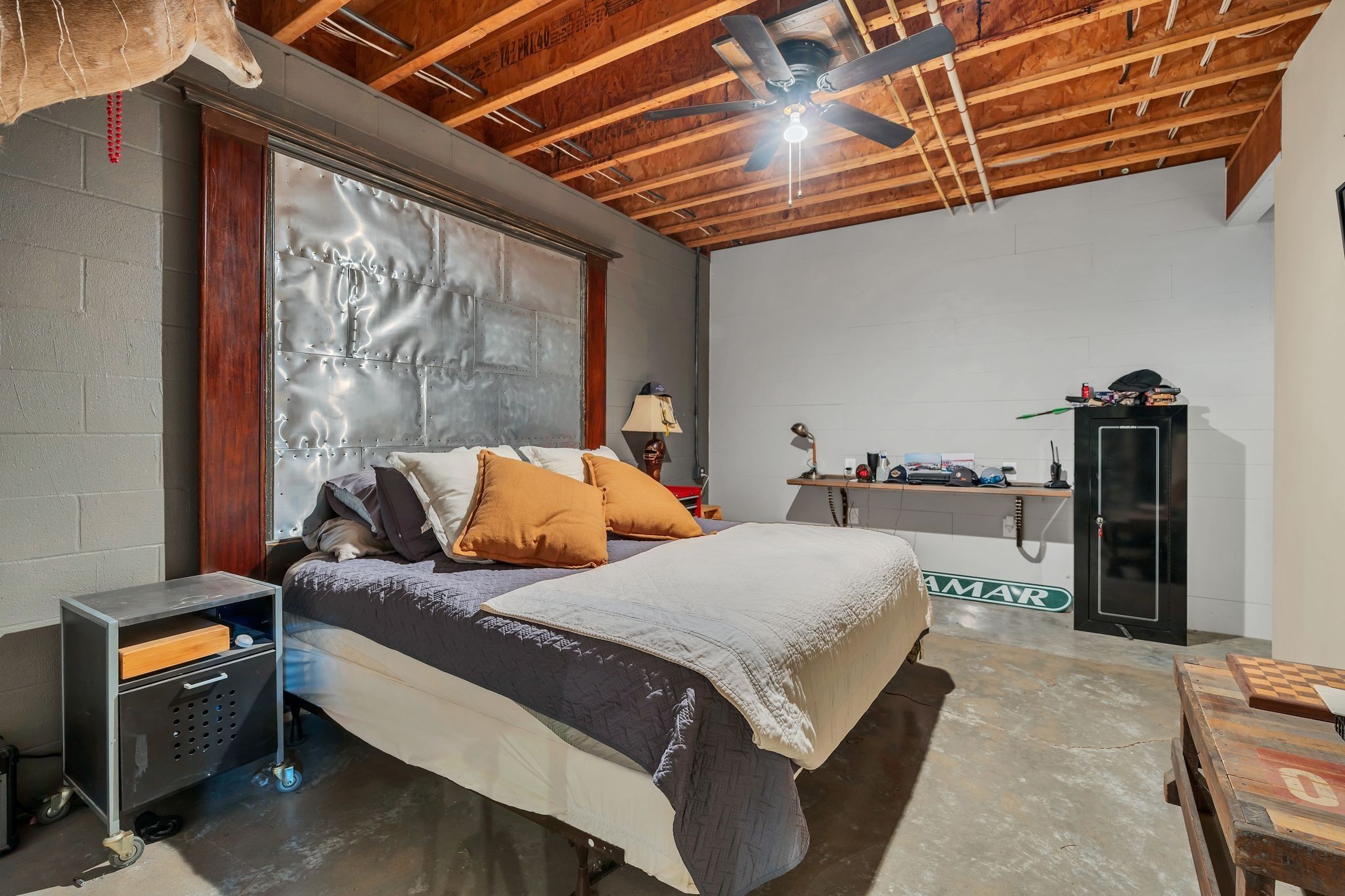 94 Oak Shadow Drive Loretto, TN 38469 - Photo 52 of 68 a bedroom with a bed and a dresser next to a window