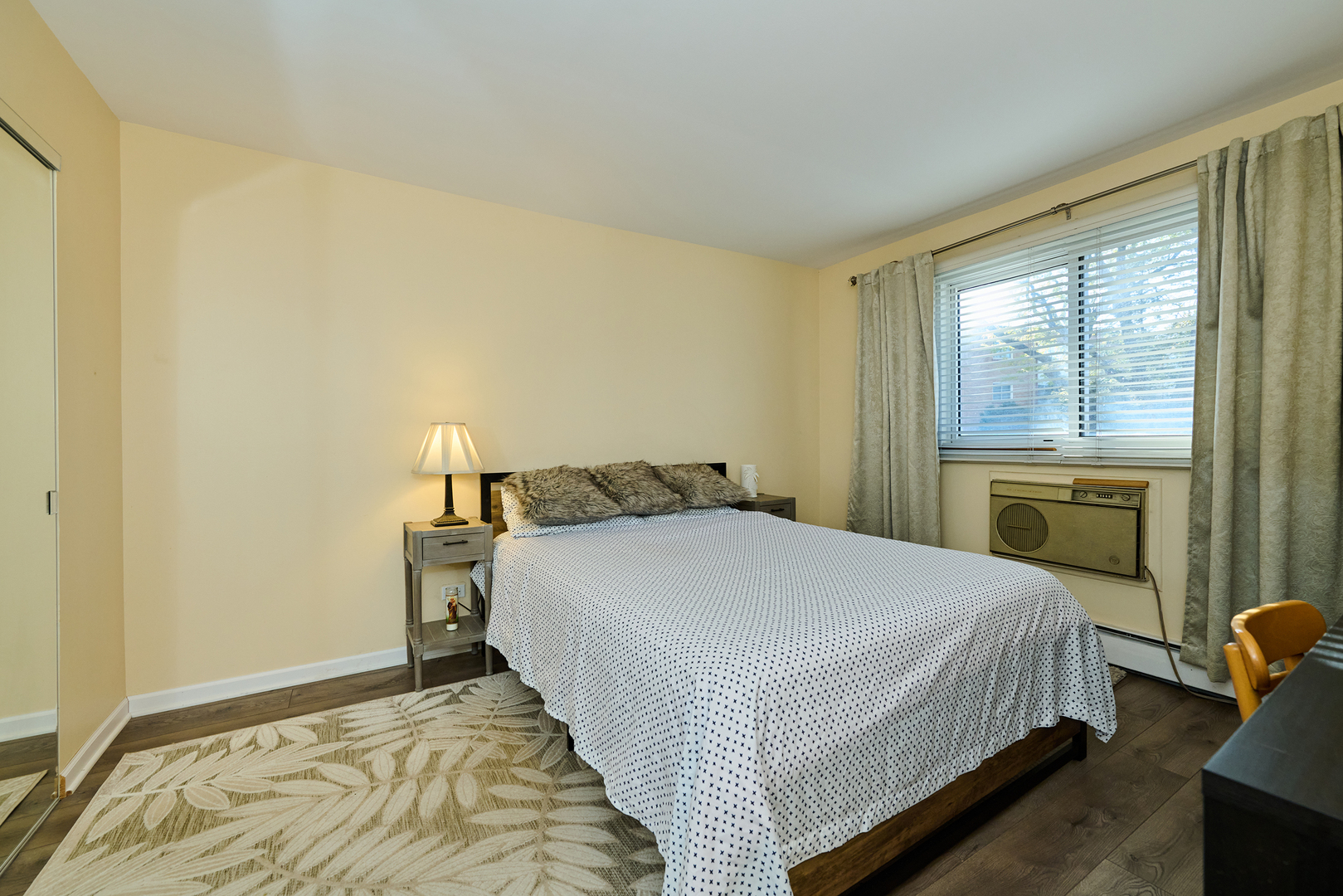 8541 Lotus Avenue, Unit 712 Skokie, IL 60077 - Photo 14 of 24 a bedroom with a bed and a window