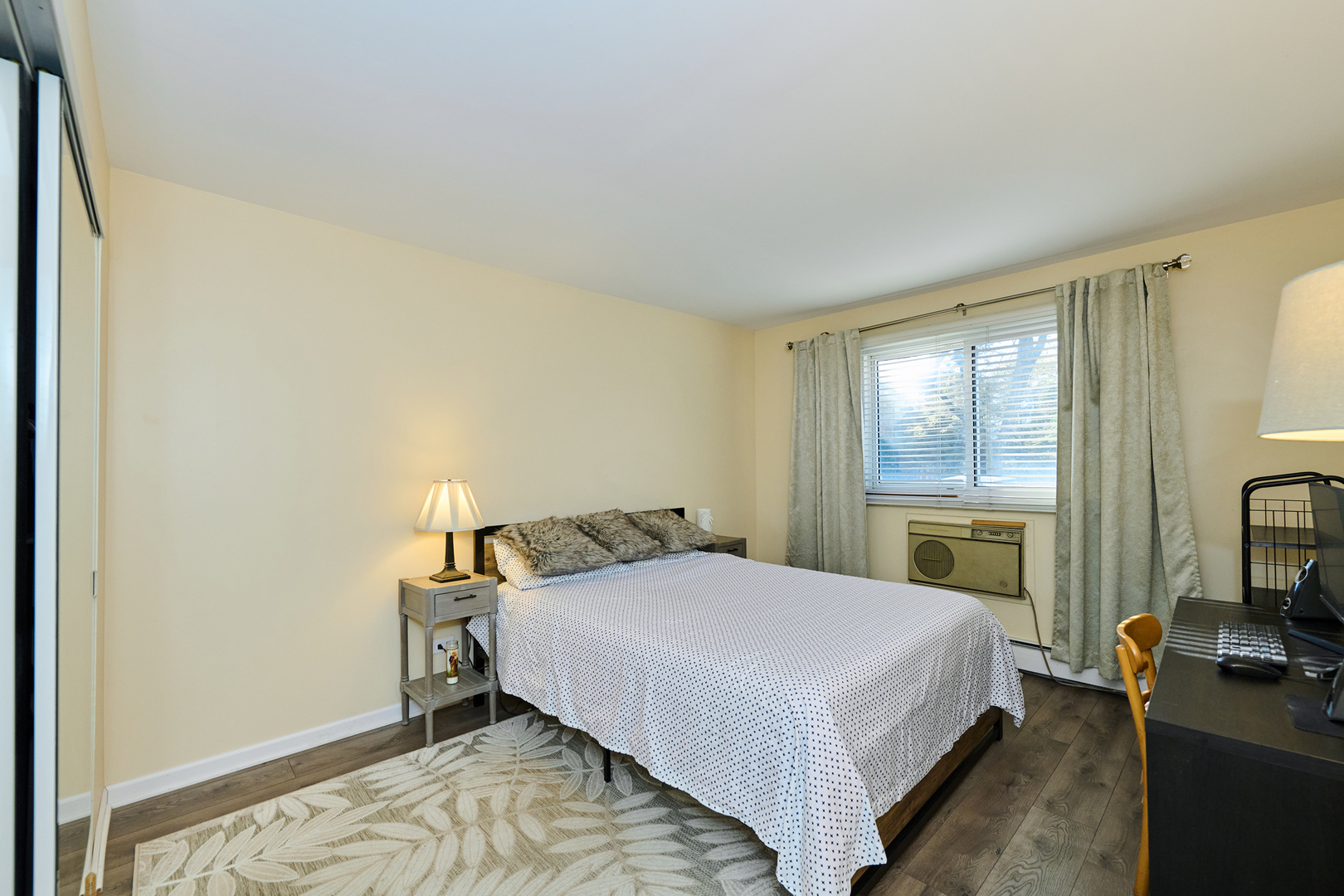 8541 Lotus Avenue, Unit 712 Skokie, IL 60077 - Photo 16 of 24 a bedroom with a bed and a flat screen tv