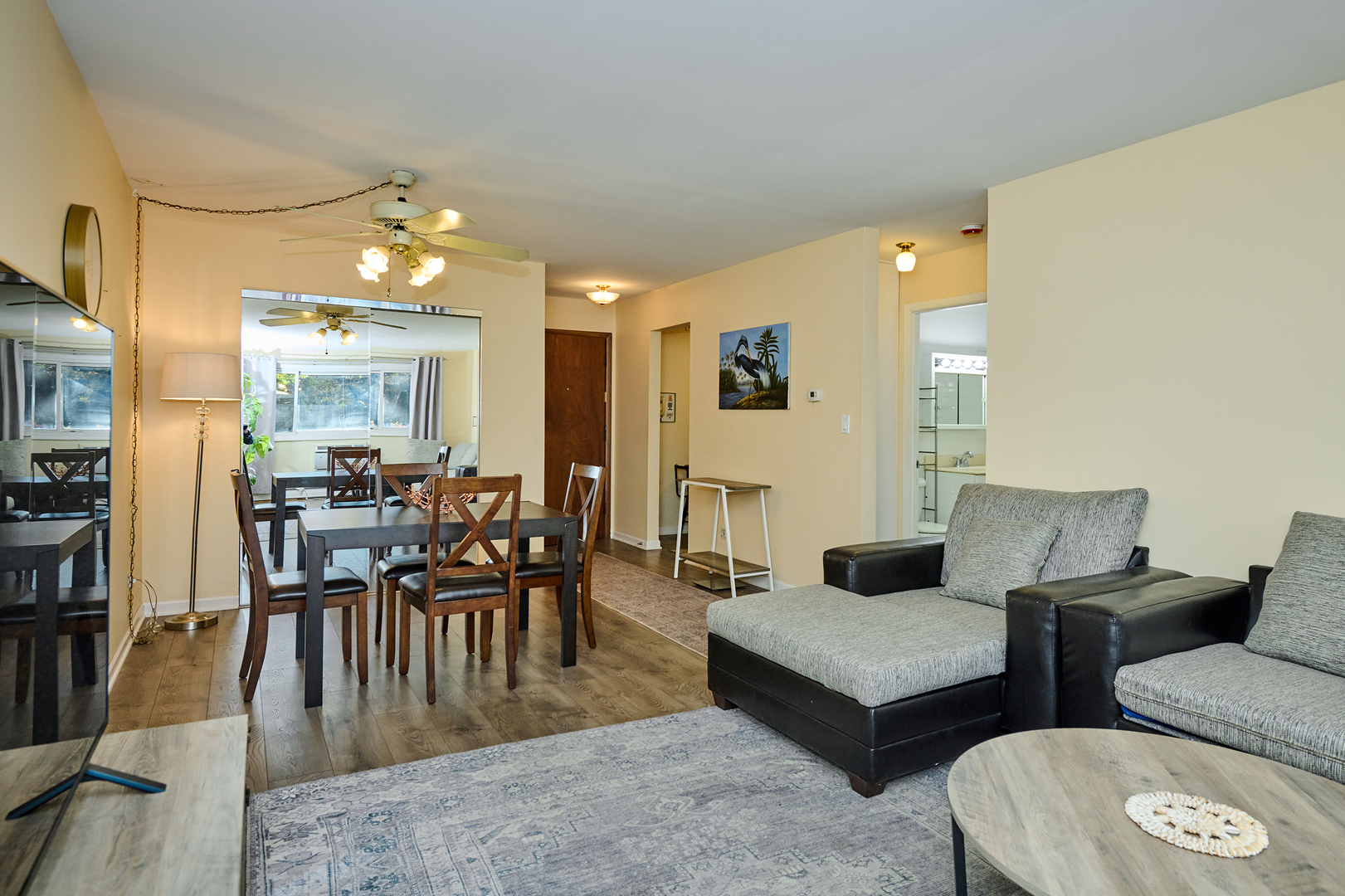 8541 Lotus Avenue, Unit 712 Skokie, IL 60077 - Photo 4 of 24 a living room with furniture and wooden floor