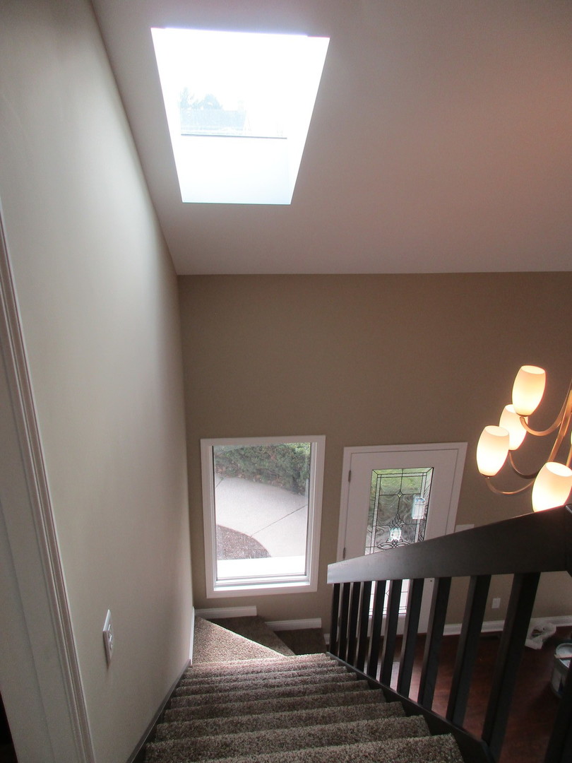 507 San Carlos Road Minooka, IL 60447 - Photo 13 of 48 a view of wooden floor and a window in the house