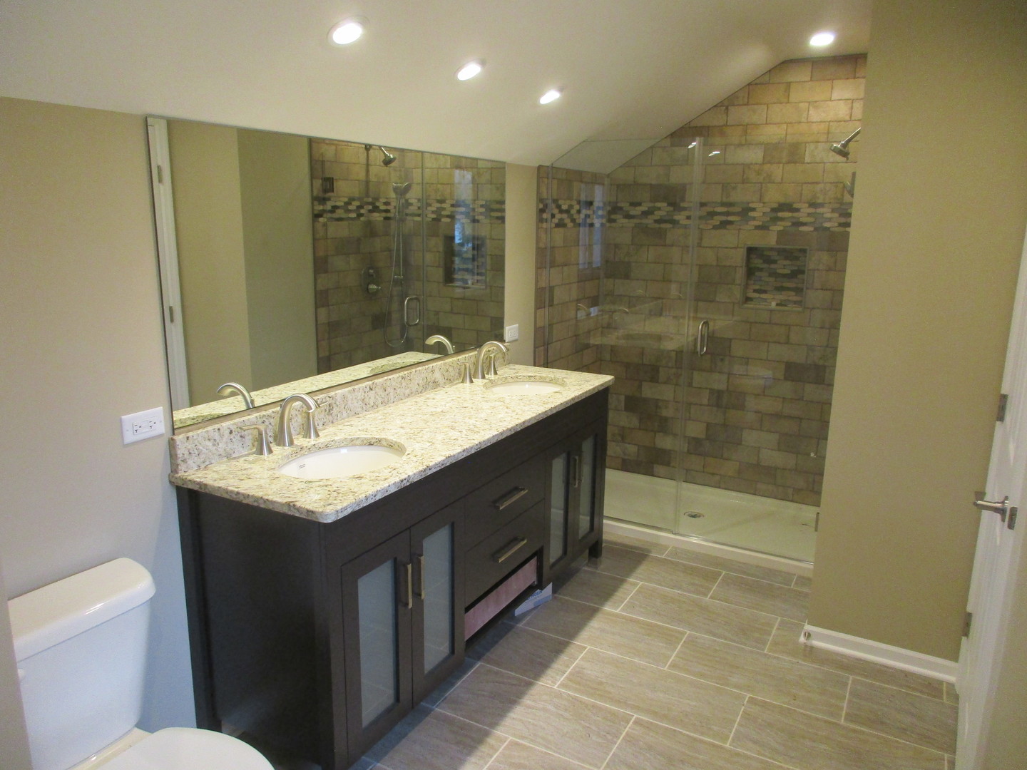 507 San Carlos Road Minooka, IL 60447 - Photo 16 of 48 a bathroom with a sink a toilet and shower