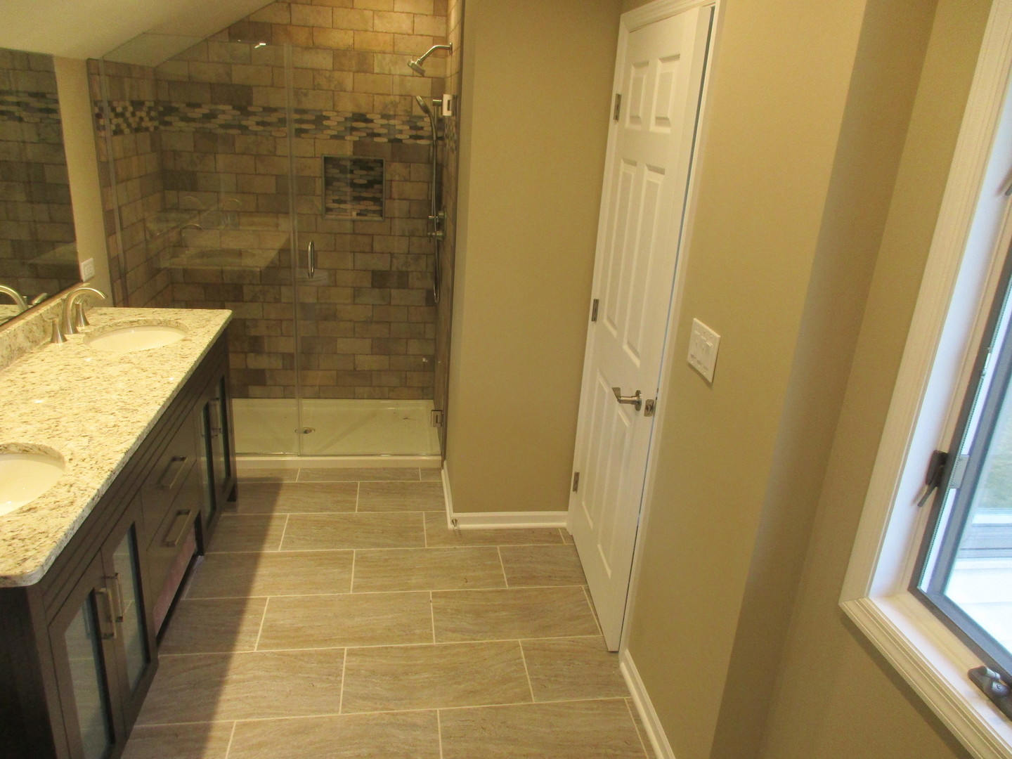 507 San Carlos Road Minooka, IL 60447 - Photo 17 of 48 a bathroom with a granite countertop shower a sink and a bathtub