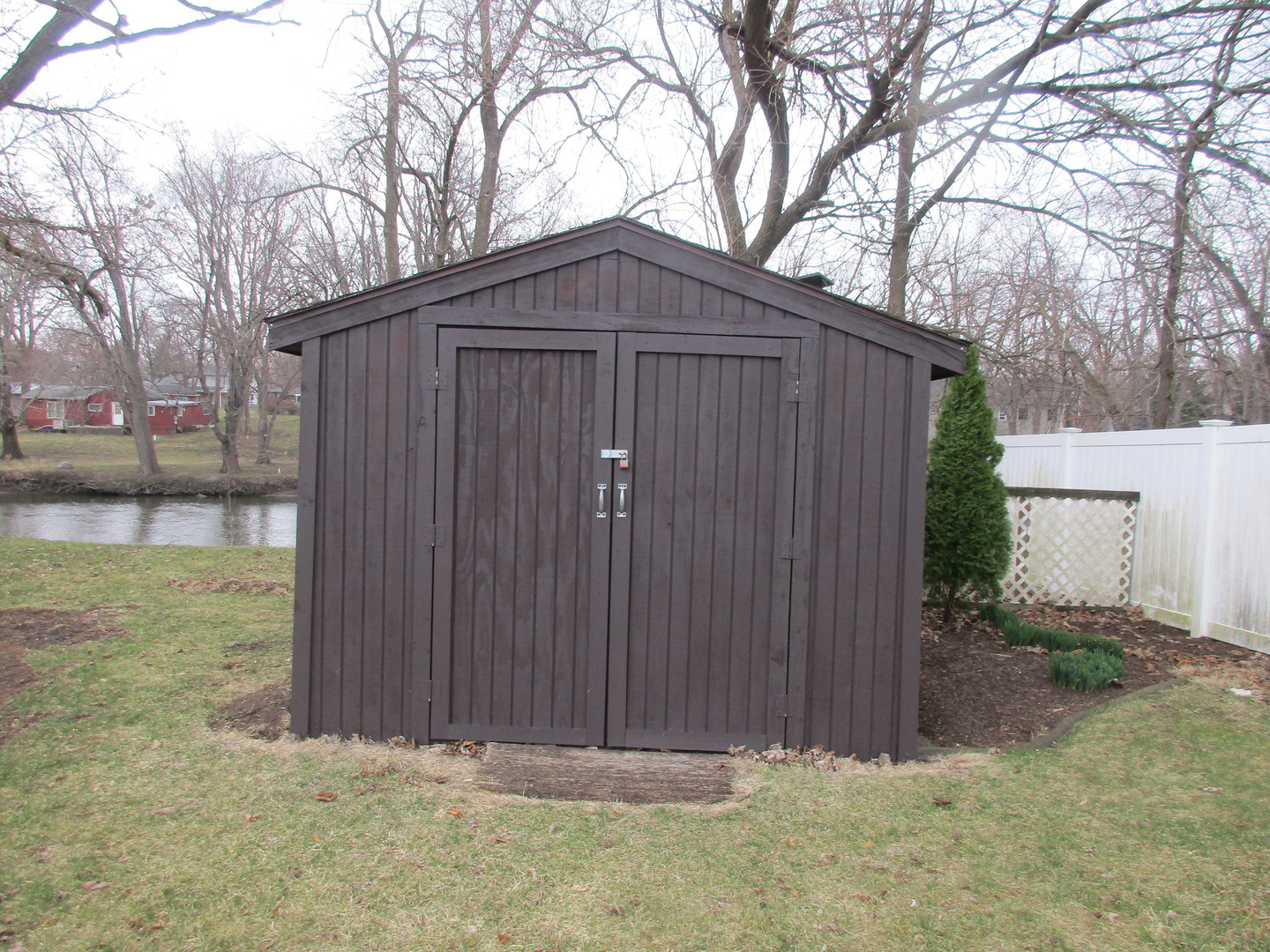 507 San Carlos Road Minooka, IL 60447 - Photo 45 of 48 a view of wooden fence under a large tree