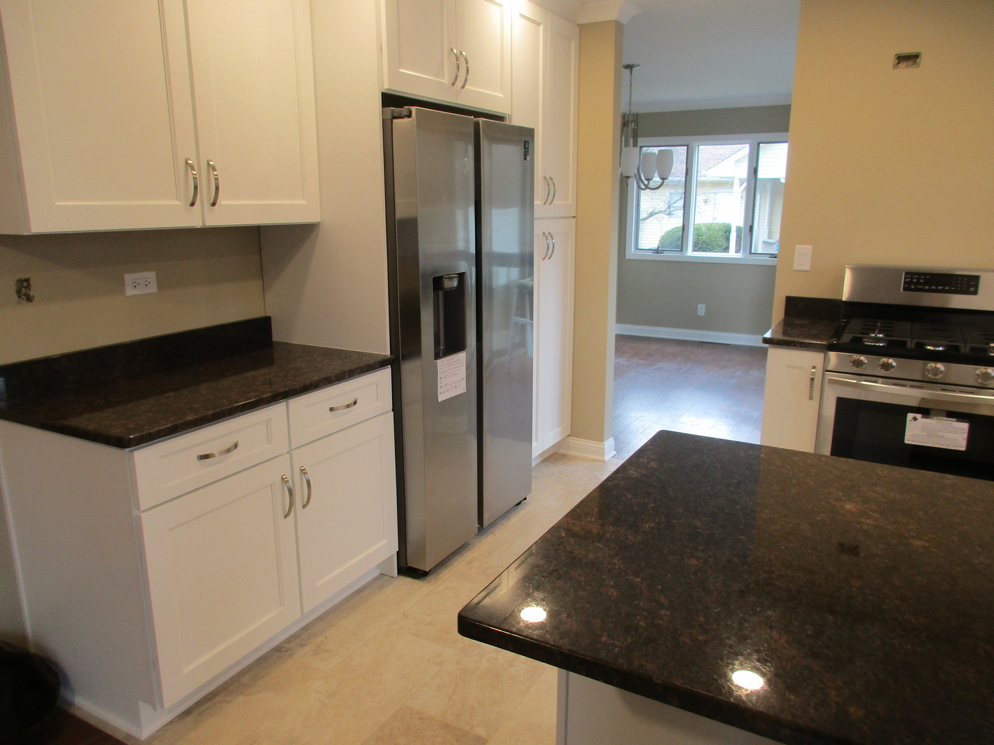 507 San Carlos Road Minooka, IL 60447 - Photo 6 of 48 a kitchen with stainless steel appliances granite countertop a stove a refrigerator and a sink