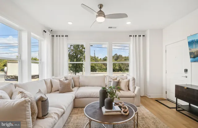 a living room with furniture and a large window