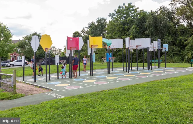 a view of a park with swings and slides