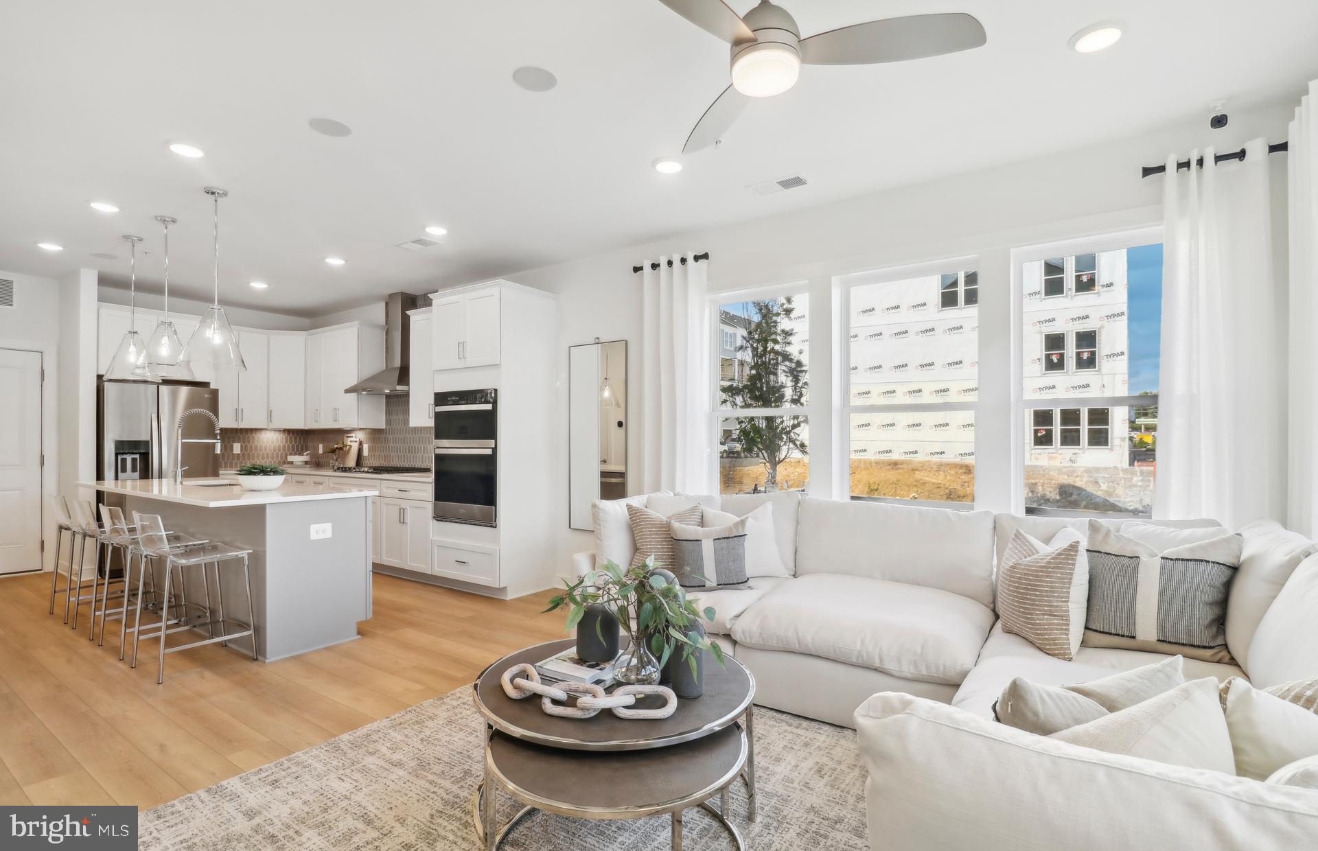 16104 Frederick Road Rockville, MD 20850 - Photo 33 of 34 a living room with stainless steel appliances furniture and a kitchen view
