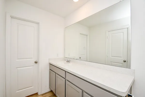 a room with a sink and cabinets