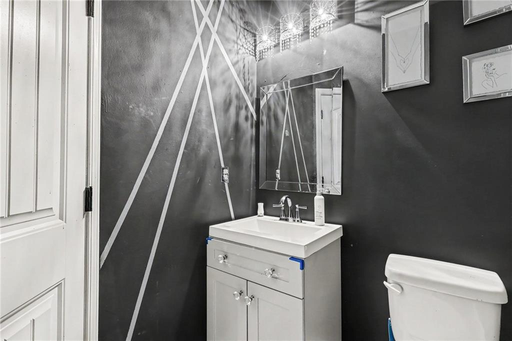 2780 Lakeview Walk Decatur, GA 30035 - Photo 27 of 37 a bathroom with a sink a toilet and a mirror