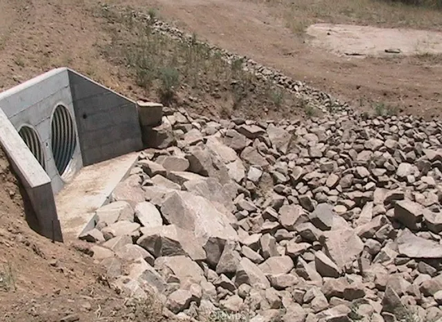 a view of a swimming pool with a yard