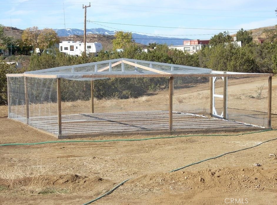 15255 Gavilan Springs Road Perris, CA 92570 - Photo 10 of 15 a view of a swimming pool with a yard