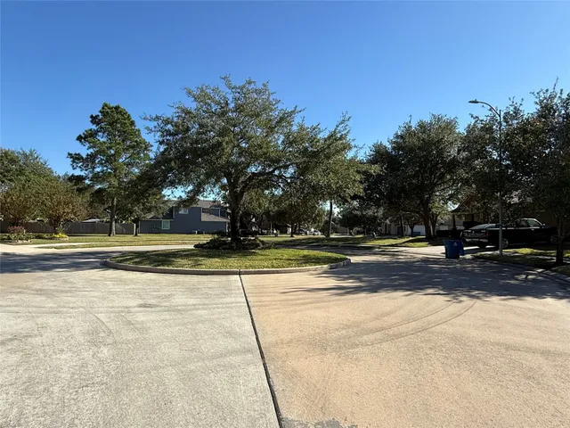 a view of a playground with basketball court