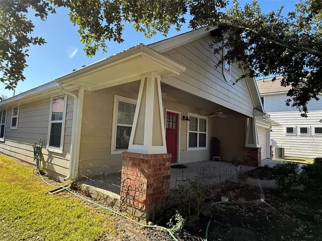 a view of house with backyard