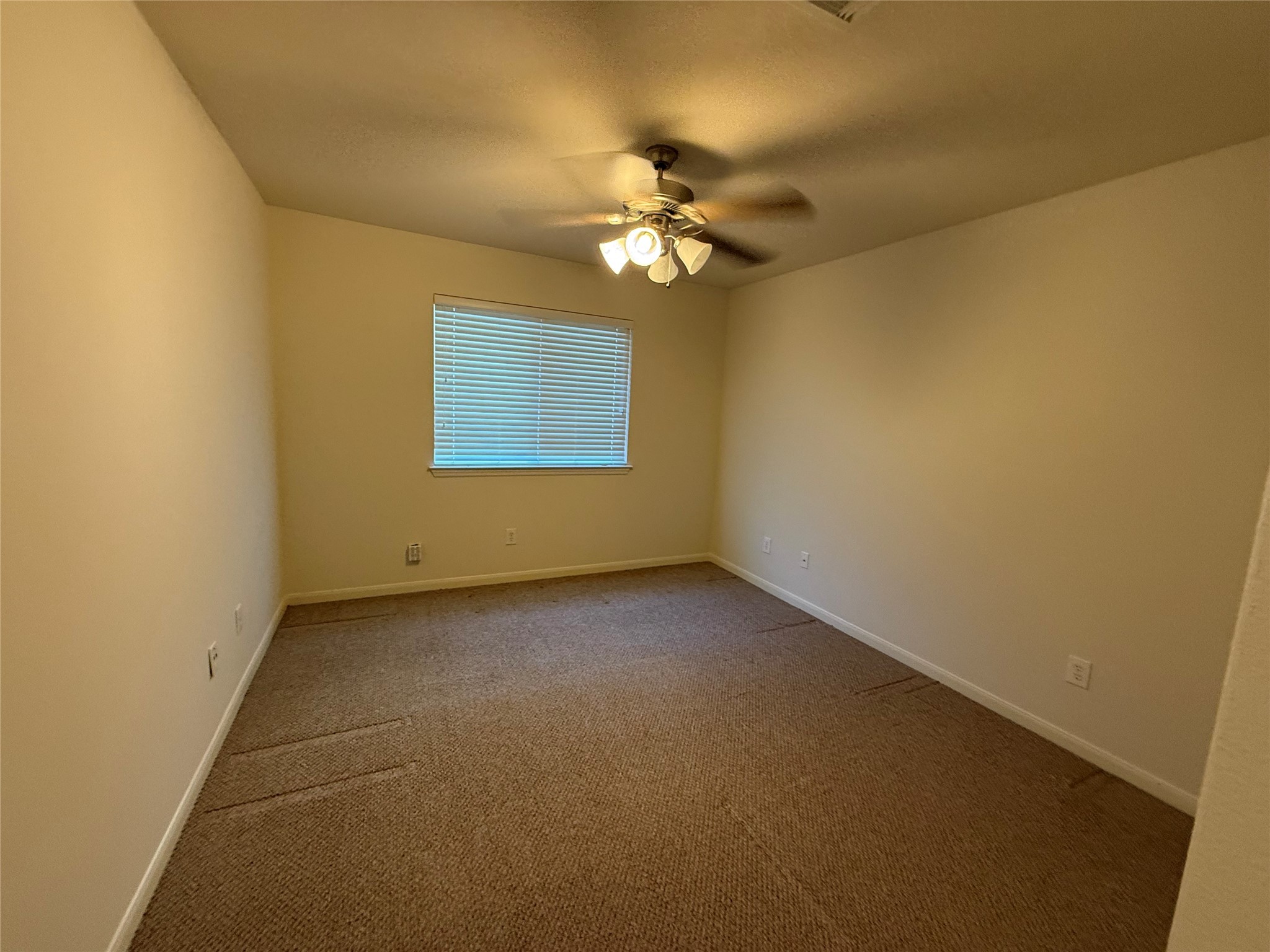19407 Rosebud Ridge Way Spring, TX 77379 - Photo 6 of 18 a view of a livingroom with a ceiling fan and window