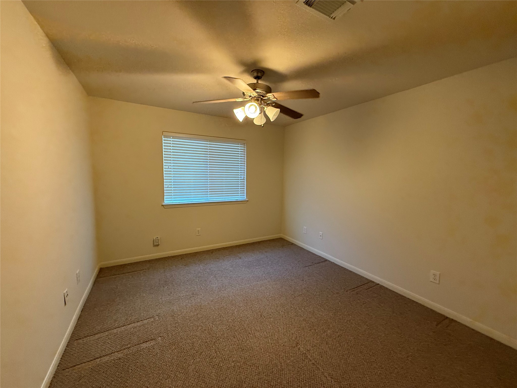 19407 Rosebud Ridge Way Spring, TX 77379 - Photo 7 of 18 a view of an empty room with a window