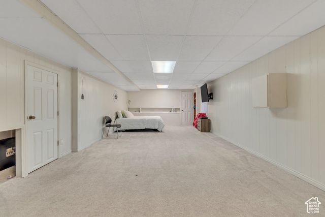 1225 North 1380th Street West Mapleton, UT 84664 - Photo 15 of 18 Carpeted bedroom with a paneled ceiling and wood walls