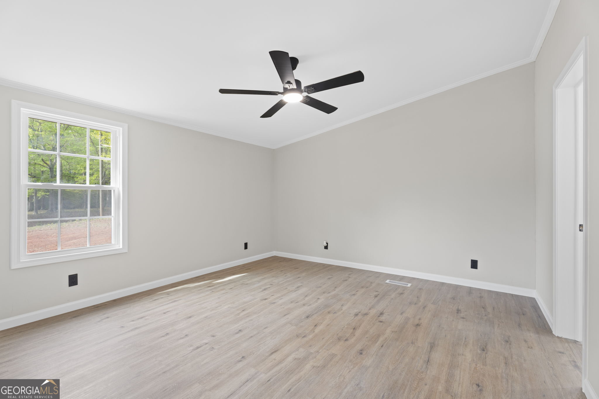 110 Kathy Lane Temple, GA 30179 - Photo 13 of 24 a view of empty room with wooden floor and fan