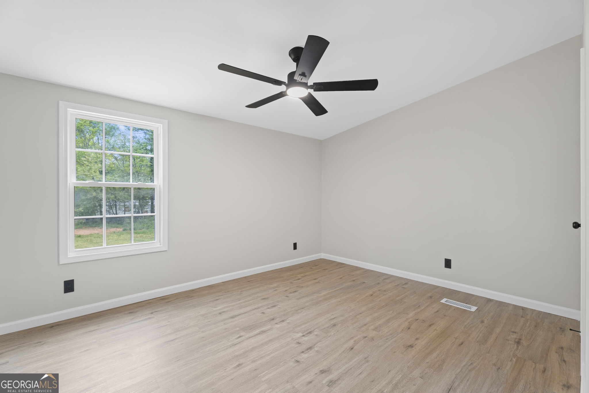 110 Kathy Lane Temple, GA 30179 - Photo 18 of 24 wooden floor in an empty room with a window
