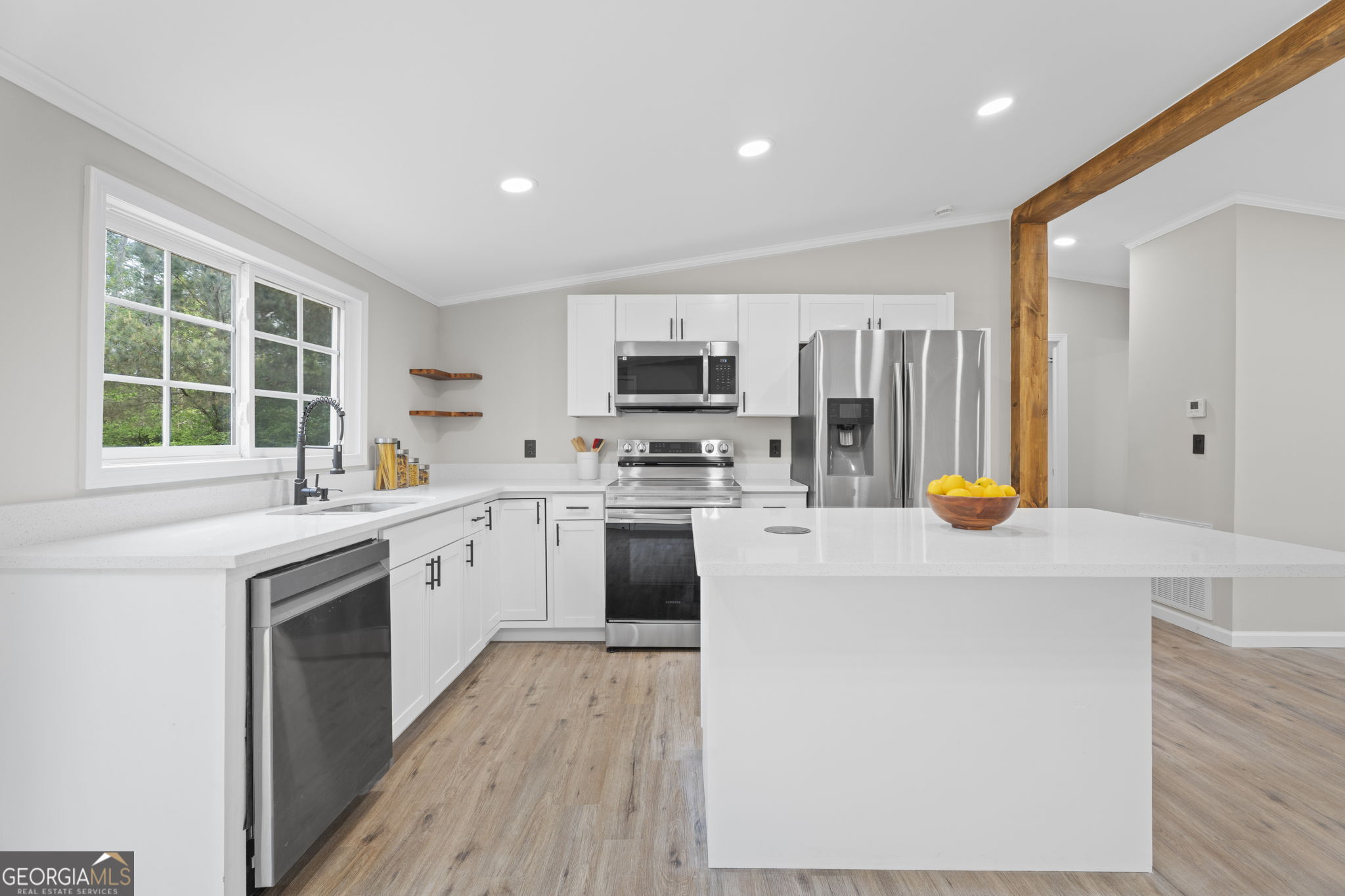 110 Kathy Lane Temple, GA 30179 - Photo 8 of 24 a kitchen with stainless steel appliances granite countertop a stove top oven a sink dishwasher and a refrigerator with wooden floor