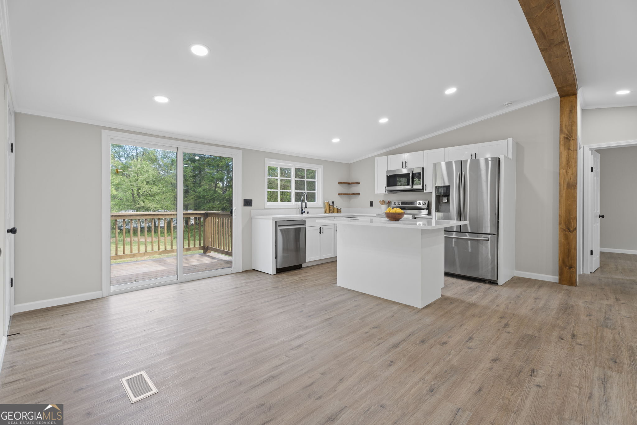110 Kathy Lane Temple, GA 30179 - Photo 10 of 24 a kitchen with stainless steel appliances a refrigerator and wooden floor