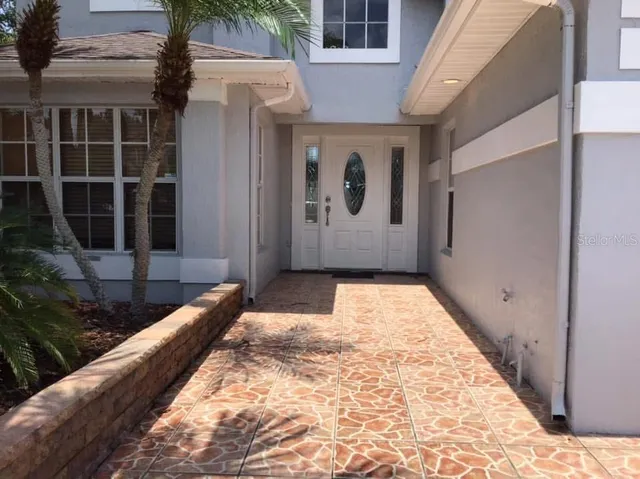 a front view of house with yard and seating space