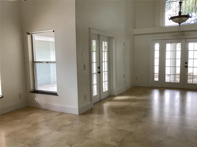 a view of a utility room and empty room