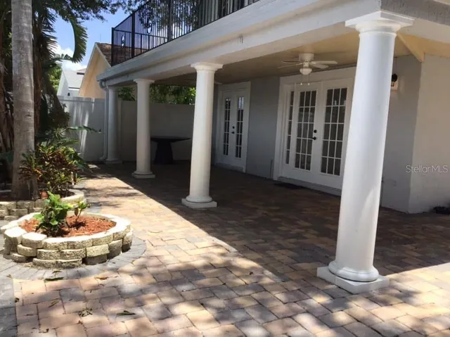a view of a backyard with potted plants