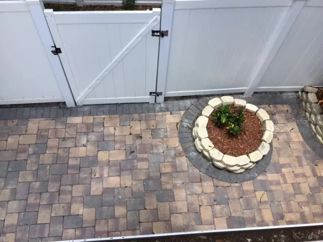 a view of balcony with wooden floor and fence