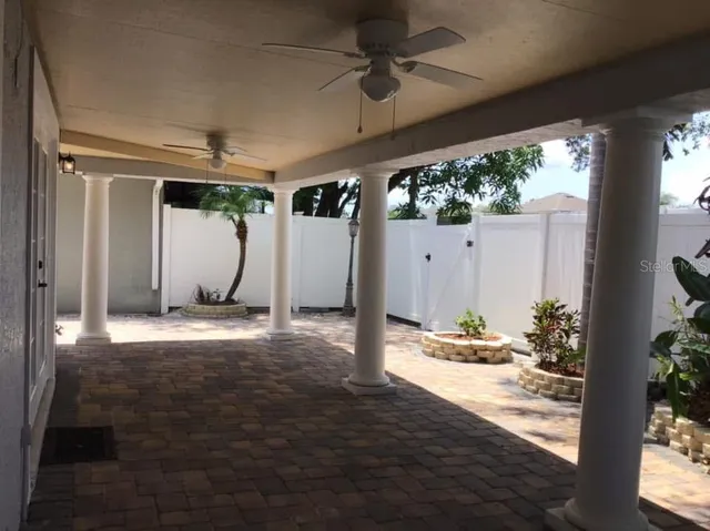 a view of balcony with wooden floor