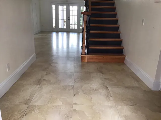 a kitchen with stainless steel appliances granite countertop a refrigerator and a stove