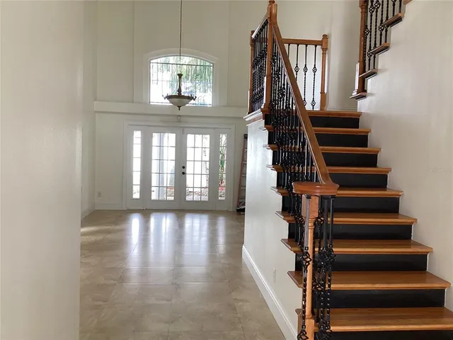 a kitchen with granite countertop a sink and a stove