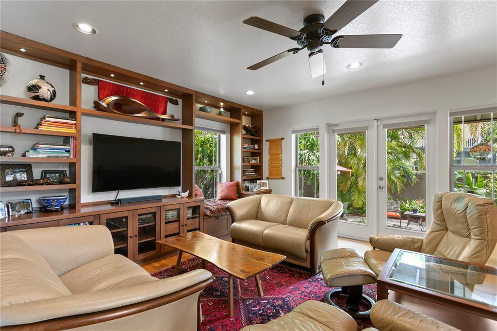 2421 Brevard Road Northeast St. Petersburg, FL 33704 - Photo 15 of 35 a living room with furniture and a flat screen tv