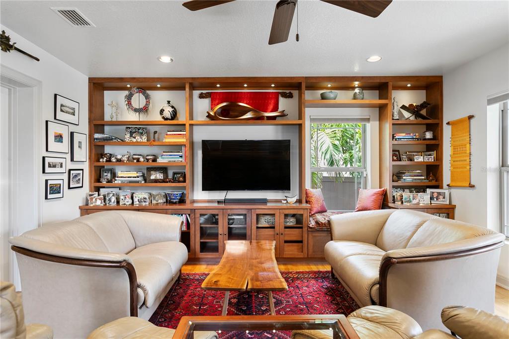 2421 Brevard Road Northeast St. Petersburg, FL 33704 - Photo 16 of 35 a living room with furniture and a flat screen tv