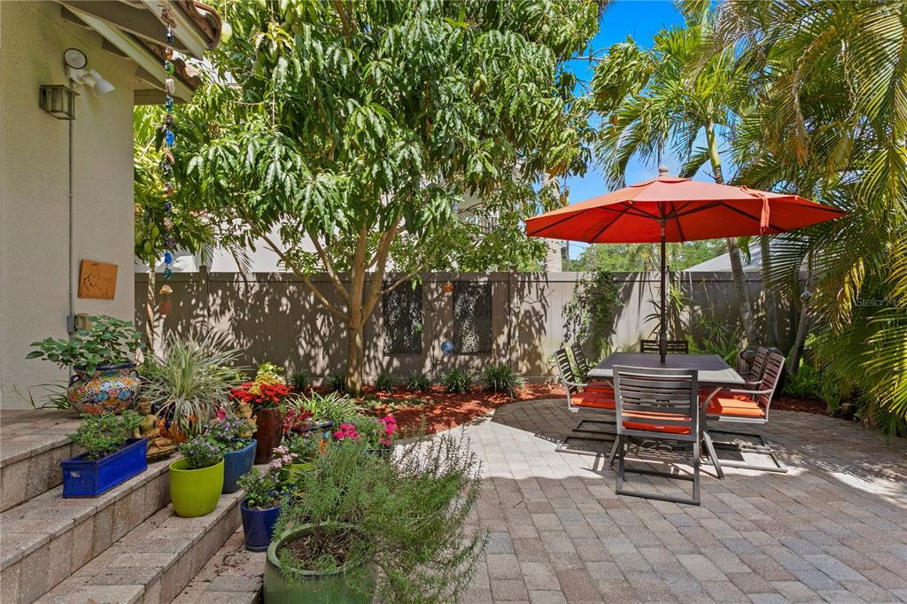 2421 Brevard Road Northeast St. Petersburg, FL 33704 - Photo 19 of 35 an outdoor space with patio furniture and umbrella