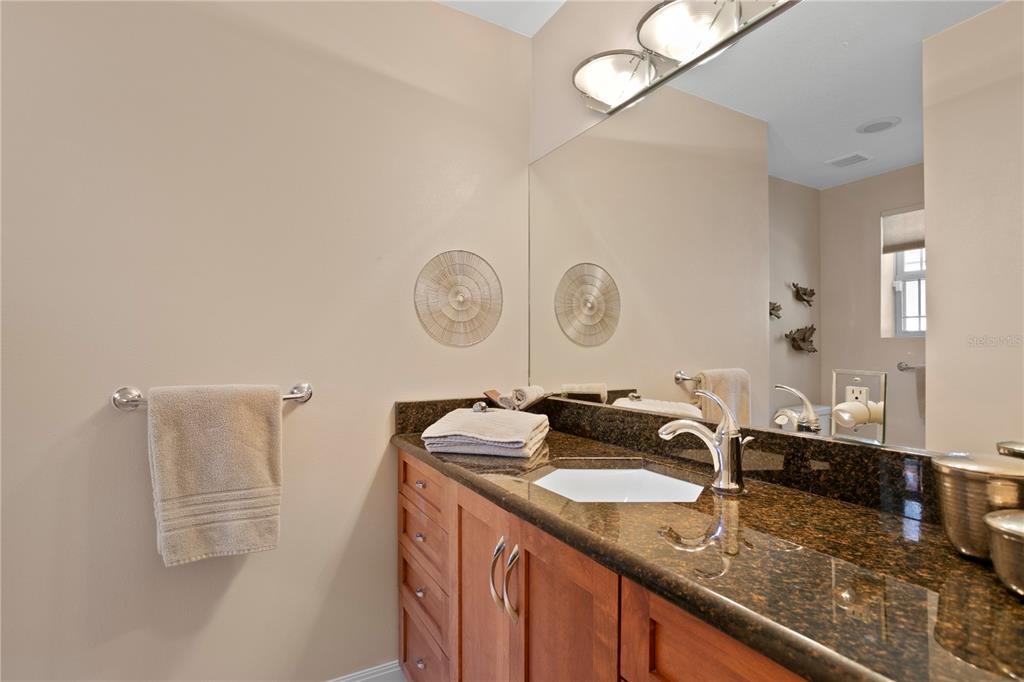 2421 Brevard Road Northeast St. Petersburg, FL 33704 - Photo 25 of 35 a bathroom with a sink and a mirror