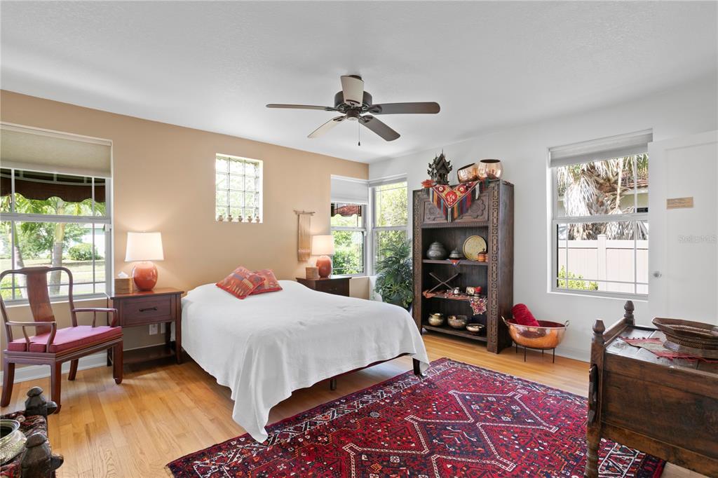 2421 Brevard Road Northeast St. Petersburg, FL 33704 - Photo 30 of 35 a bed room with a bed and furniture