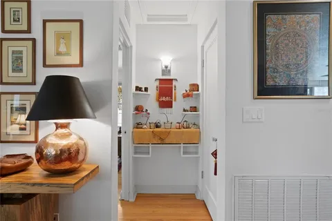 a kitchen with a sink a counter space dining table and chairs