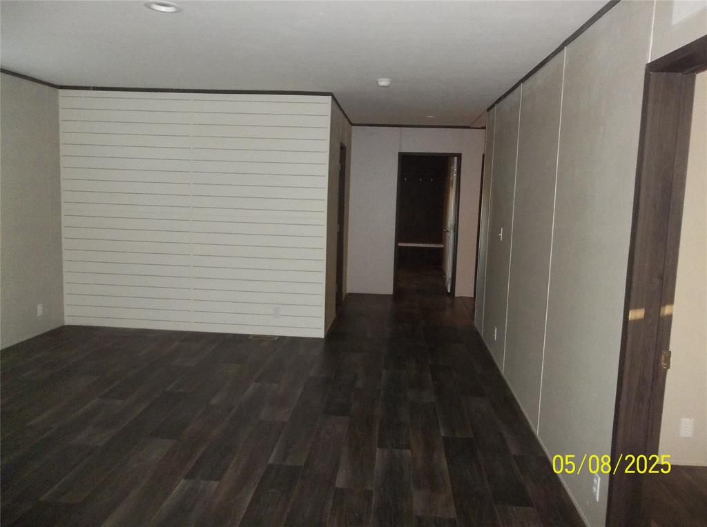 531 Blair Road Waxahachie, TX 75165 - Photo 15 of 40 a view of a hallway with wooden floor