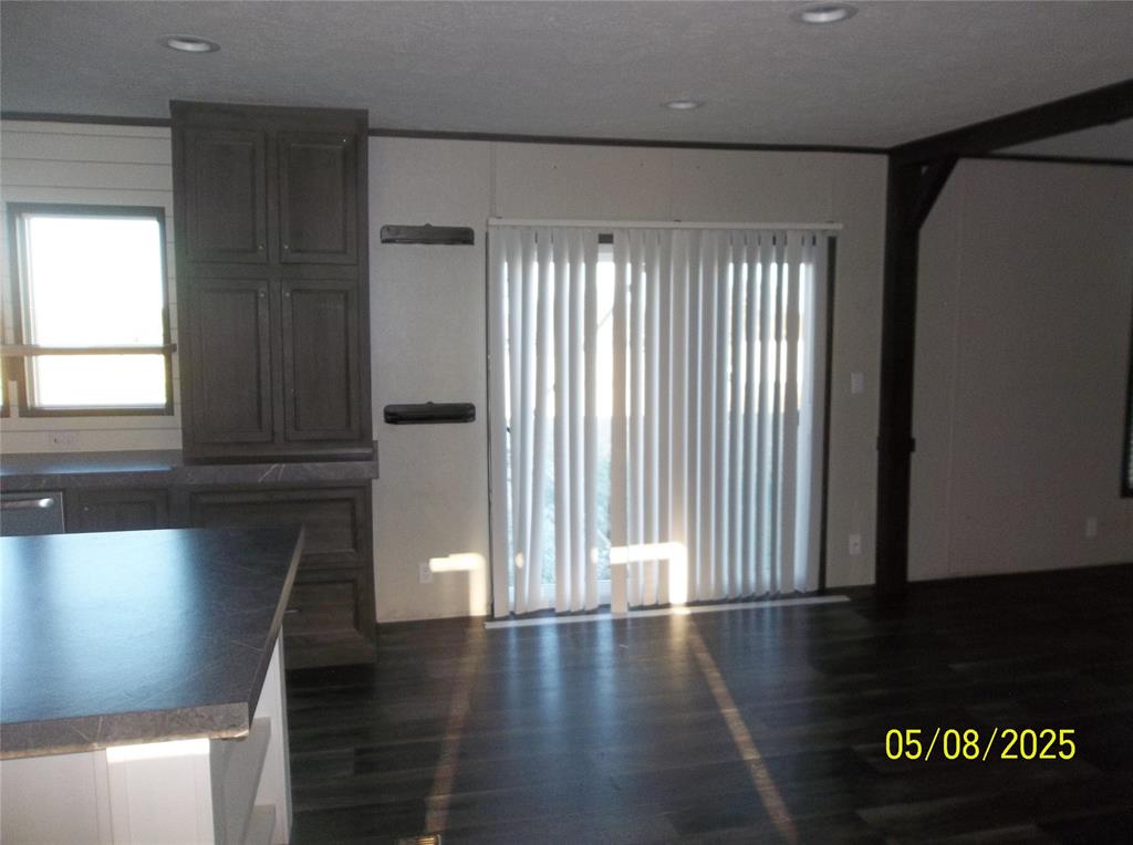 531 Blair Road Waxahachie, TX 75165 - Photo 19 of 40 a view of wooden floor and windows in a room