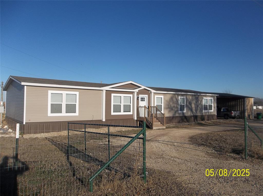 531 Blair Road Waxahachie, TX 75165 - Photo 2 of 40 a house view with a backyard space
