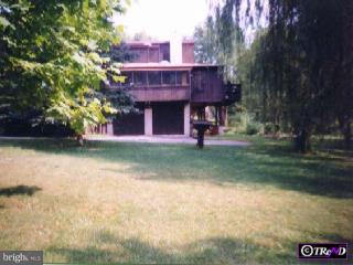 218 Chesterville Road Landenberg, PA 19350 - Photo 1 of 1 a view of a house with a yard